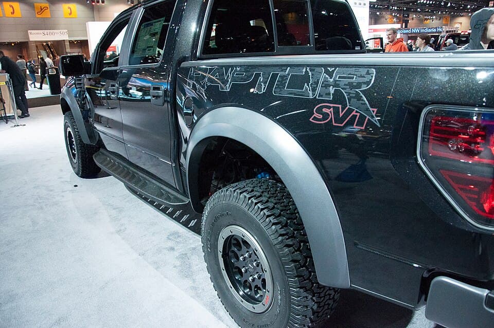2014 SVT Raptor rear three-quarter at the Chicago Auto Show, with the large RAPTOR SVT bedside decal and the beadlock-look wheels.