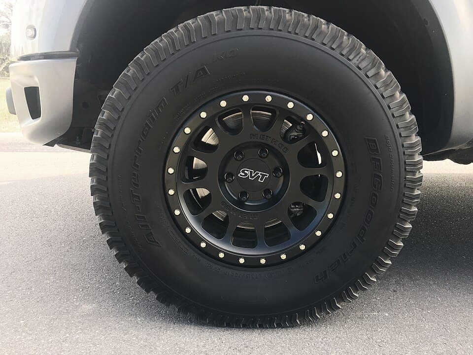 Close-up of a factory SVT Raptor wheel and BFGoodrich All-Terrain T/A tyre — the 315/70R17 fitment that came on the truck from new.