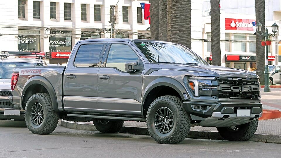 Grey third-gen Raptor with a bedside RAPTOR graphic, side profile on a street in Chile.