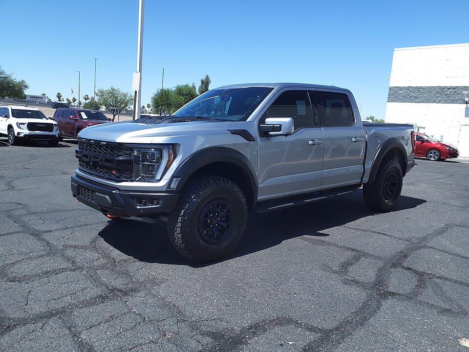 2023 Raptor R in silver on a dealer lot in Mesa, Arizona, front three-quarter — the red R badge in the grille is the tell against a standard Raptor.